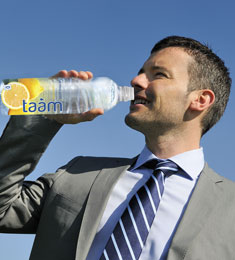 man drinking taam water